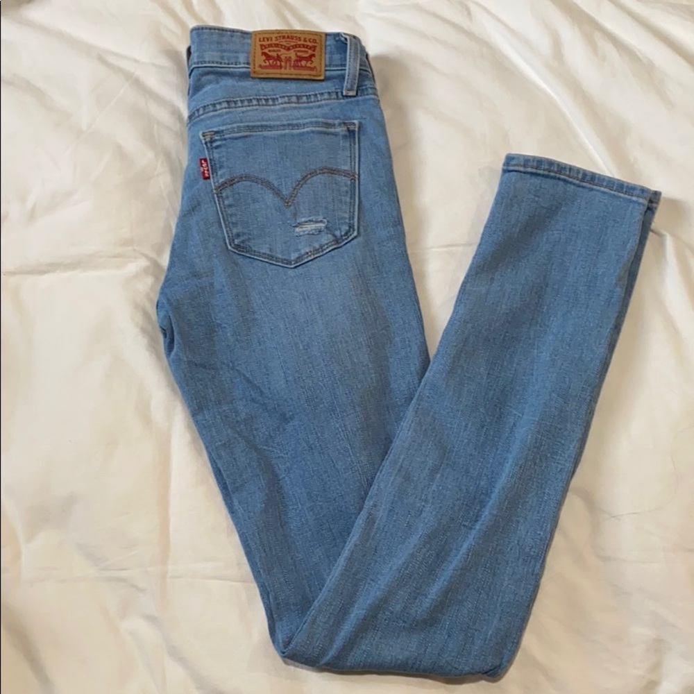 Ripped Levis 711 Jeans